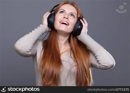 Happy young woman listening to music