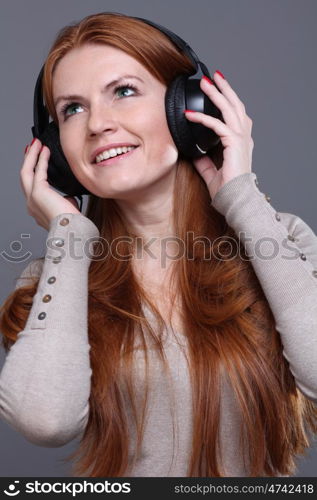 Happy young woman listening to music