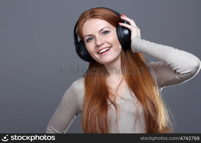 Happy young woman listening to music