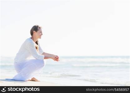 Happy young woman looking at sea