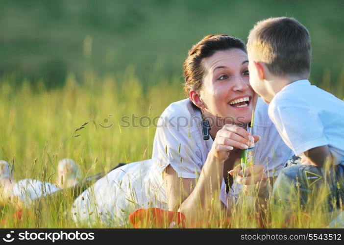 happy young woman mother play and outdoor with beautiful child