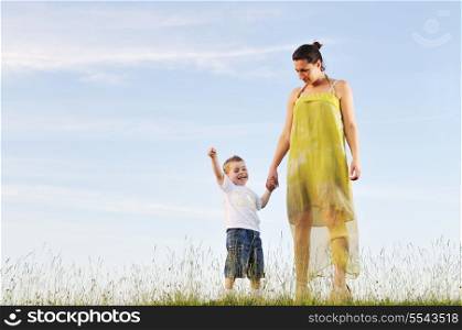 happy young woman mother play and outdoor with beautiful child