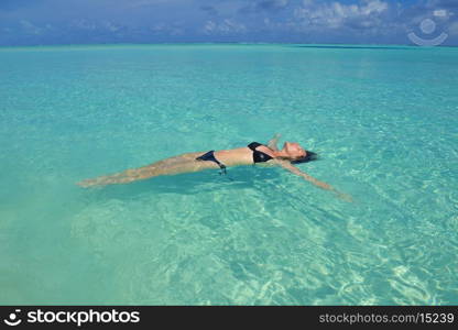 happy young woman on summer vacation on beautiful tropical beach have fun enjoy and relax