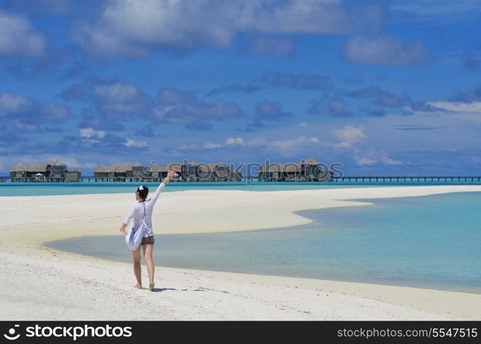 happy young woman on summer vacation on beautiful tropical beach have fun enjoy and relax