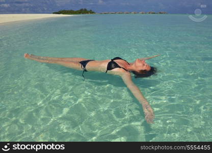 happy young woman on summer vacation on beautiful tropical beach have fun enjoy and relax