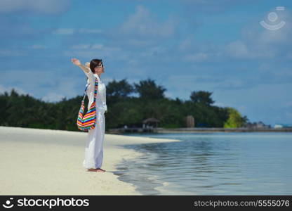 happy young woman on summer vacation on beautiful tropical beach have fun enjoy and relax