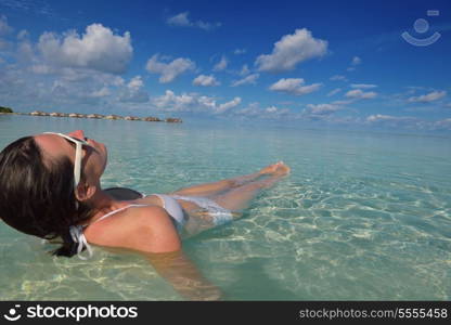 happy young woman on summer vacation on beautiful tropical beach have fun enjoy and relax