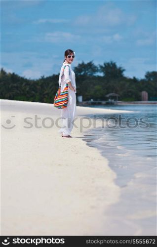 happy young woman on summer vacation on beautiful tropical beach have fun enjoy and relax