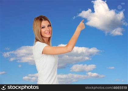 Happy young woman pointing something with a blue sky of background