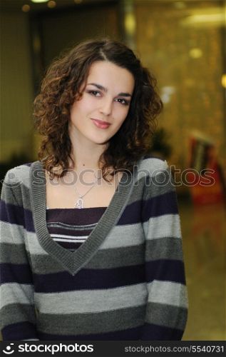 happy young woman posing indoor