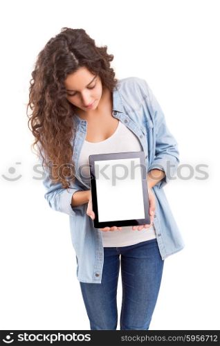 Happy young woman presenting your product in a tablet computer