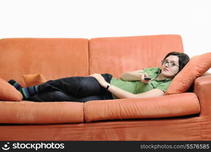 happy young woman relax on orange sofa isolated on white in studio