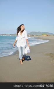 happy young woman relax onbeautiful beach at morning