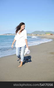 happy young woman relax onbeautiful beach at morning