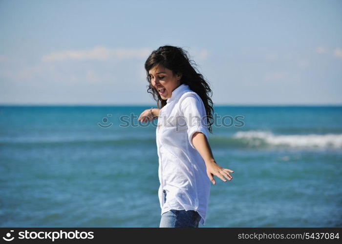 happy young woman relax onbeautiful beach at morning