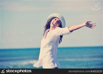 happy young woman relax onbeautiful beach at morning