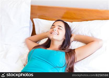 Happy young woman relaxing in the morning