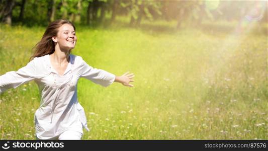 Happy Young Woman Running at the Green Meadow in White Clothes.