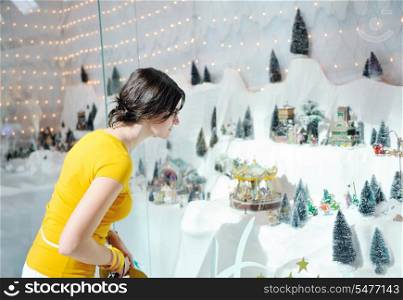 happy young woman shopping in big modern city mall