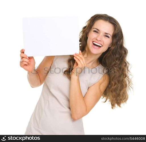 Happy young woman showing blank paper