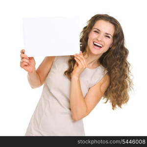 Happy young woman showing blank paper