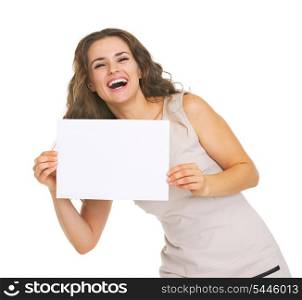 Happy young woman showing blank paper sheet