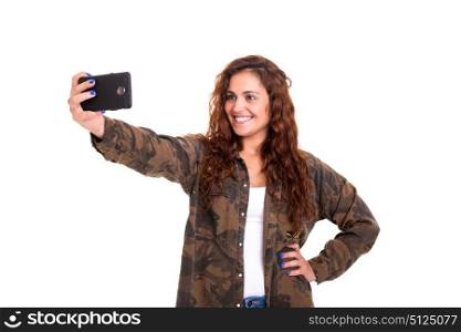 Happy young woman taking self portrait photography through smart phone over white background.