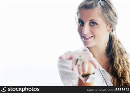 happy young woman throw keys from their apartment and home in ai and representing concept of joy and financial freedom