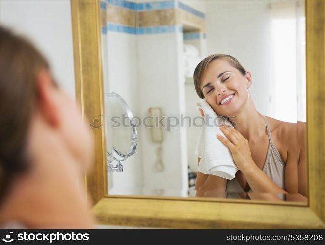 Happy young woman towel in bathroom