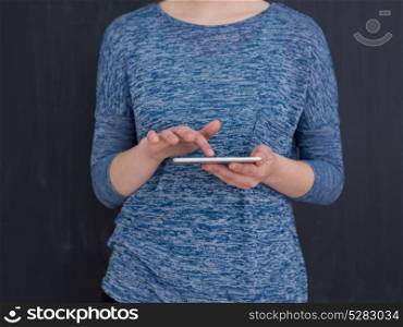 Happy young woman using tablet computer isolated over gray background
