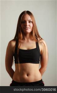 Happy young woman wear black sportswear.. Sport exercise and wellbeing. Young woman with healthy lifestyle body wear black sportswear.