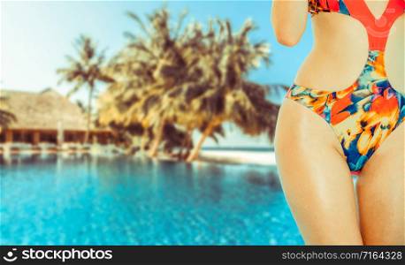 Happy young woman wearing swimsuit at tropical sand beach resort in summer for holiday travel vacation.. Happy young woman at beach in summer vacation.