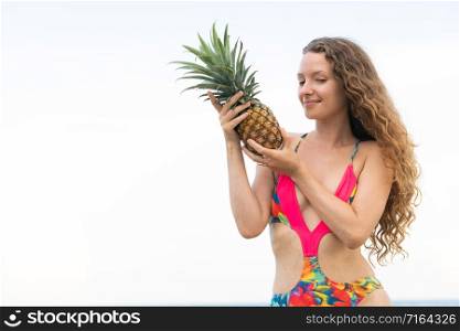 Happy young woman wearing swimsuit on tropical sand beach in summer for holiday travel vacation.. Happy woman wearing swimsuit on beach in summer