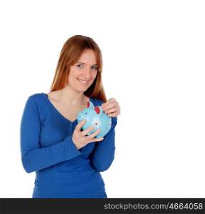 Happy young woman with a blue money box isolated on a white background