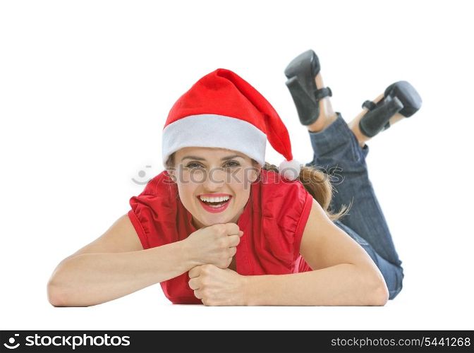 Happy young woman with Christmas hat laying on floor