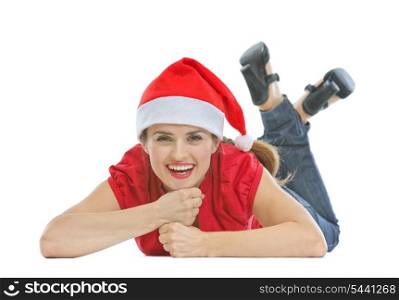 Happy young woman with Christmas hat laying on floor