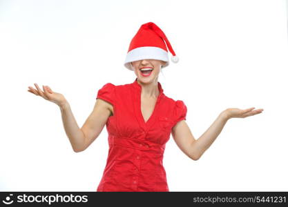 Happy young woman with Christmas hat over eyes shrugs