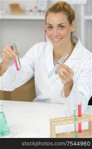happy young woman with genetic research in the laboratory