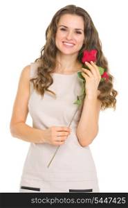 Happy young woman with red rose
