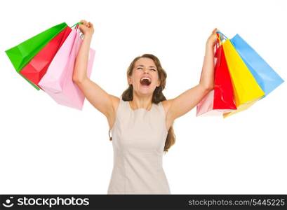 Happy young woman with shopping bags rejoicing success