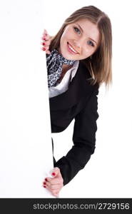 Happy young women peeking through a blank board over white background