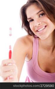 happy young women showing her toothbrush over white background