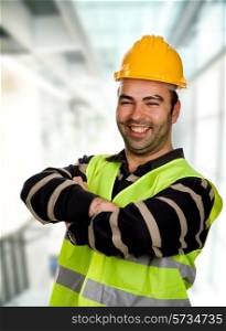 happy young worker inside a modern building