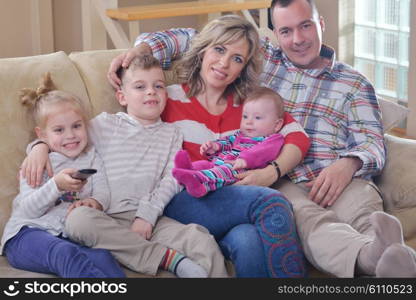 hapy young family have fun with their children at modern living room home indoors