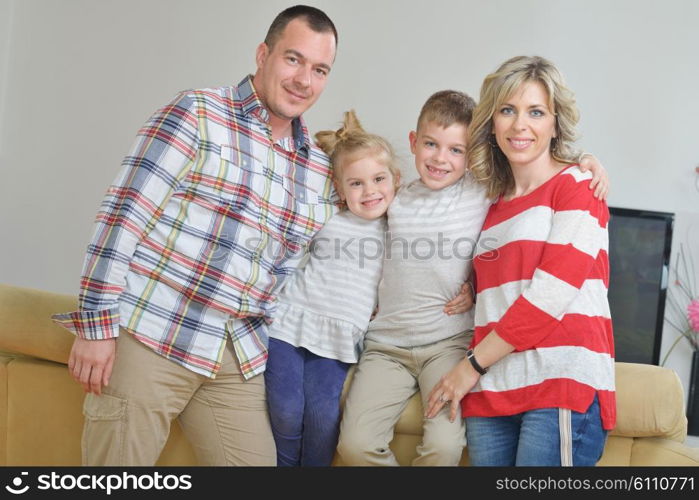 hapy young family have fun with their children at modern living room home indoors