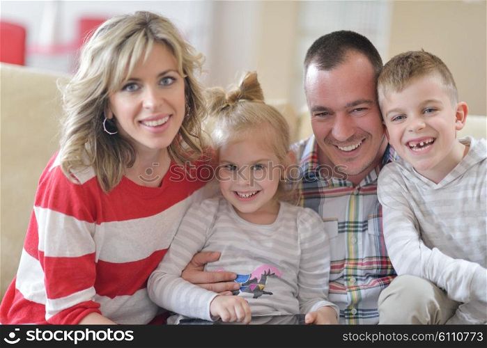 hapy young family have fun with their children at modern living room home indoors