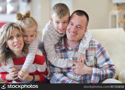 hapy young family have fun with their children at modern living room home indoors