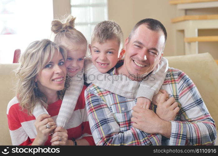 hapy young family have fun with their children at modern living room home indoors