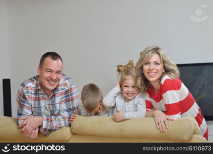 hapy young family have fun with their children at modern living room home indoors