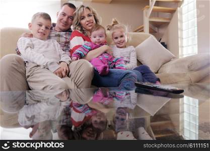 hapy young family have fun with their children at modern living room home indoors